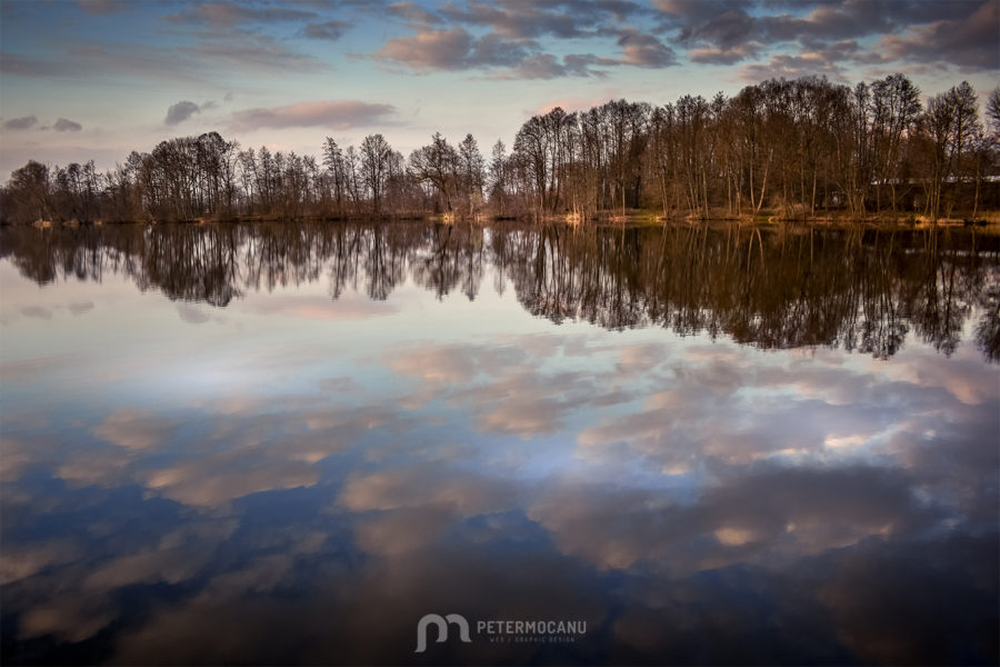 Landscape Photography of a Lake with reflections of a cloudy sky